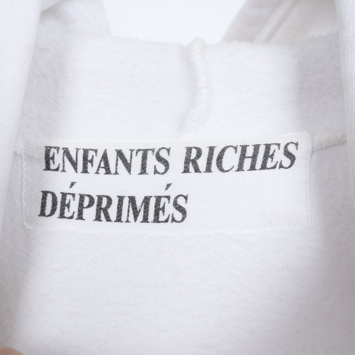 ERD X INDICATES PRIOR DAMAGE WHITE HOODIE