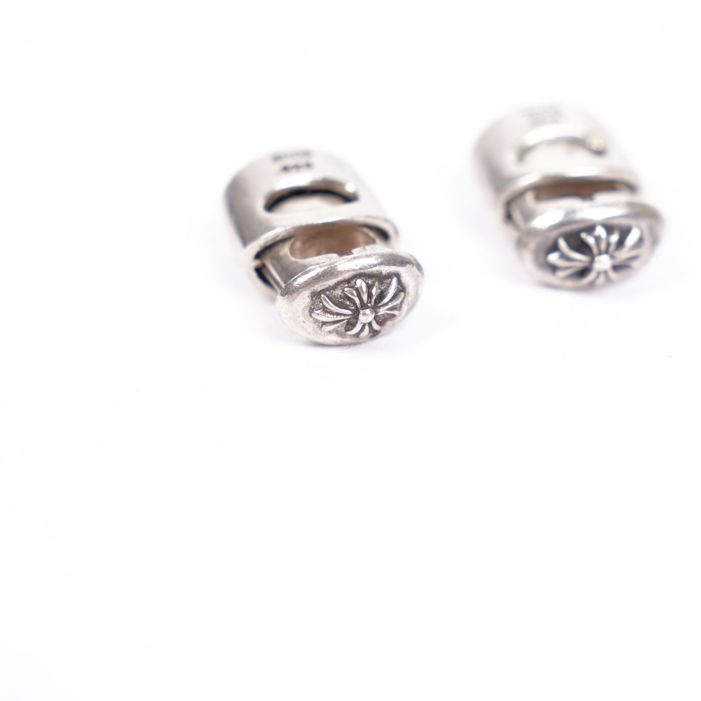 CHROME HEARTS PAIR OF STERLING SILVER .925 LACE LOCK LACE STOPPERS