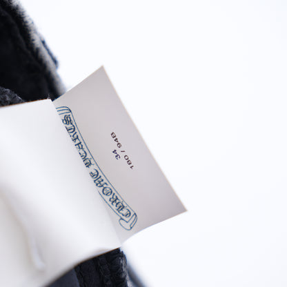 CHROME HEARTS BLACK AND WHITE PATCH FLEUR KNEE DENIM